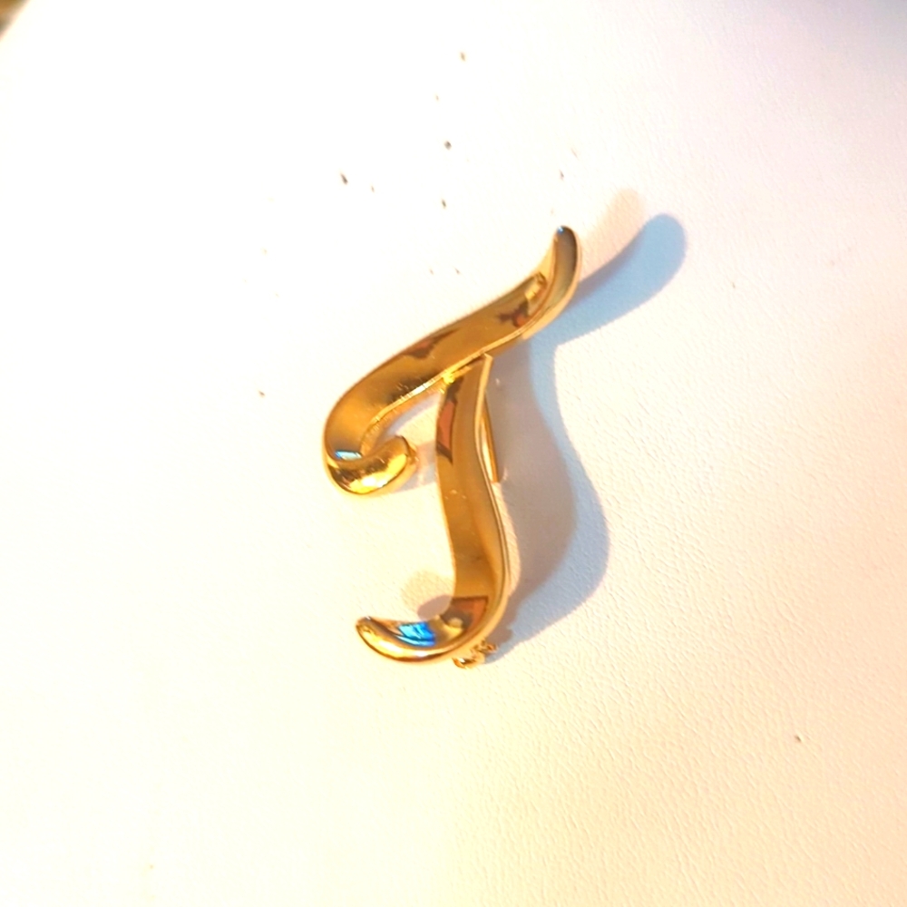 The letter J  gold tone